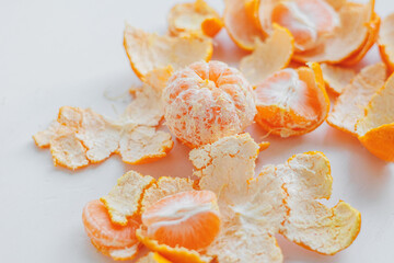 orange juicy citrus tangerines rich in vitamin C, for food in the winter season. Delicious orange slices on the kitchen table