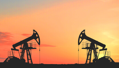 Oil prices on global market. Crude oil Pumpjack on oilfield on sunset. Fossil crude production. Oil...