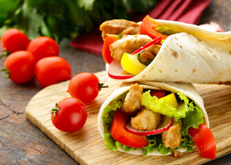 traditional food doner in pita bread with vegetables and chicken