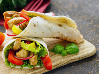 traditional food doner in pita bread with vegetables and chicken