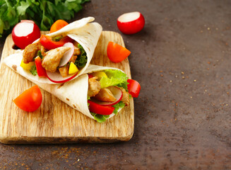 traditional food doner in pita bread with vegetables and chicken