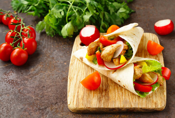 traditional food doner in pita bread with vegetables and chicken
