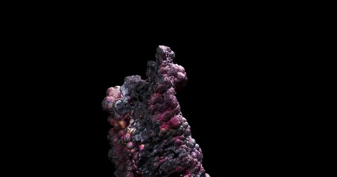 rainbow iridescent goethite rotating 360&deg; in 4k isolated on black background. macro detail close-up rough raw unpolished semi-precious gemstone.
