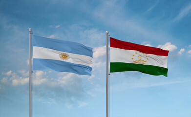 Tajikistan and Argentina flags, country relationship concept