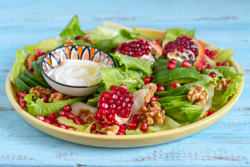 Pomegranate Avocado Lettuce Walnut Salad for Jewish holiday Rosh Hashanah.