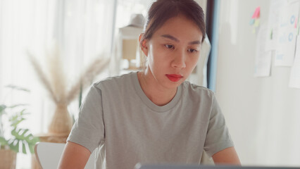 Close-up Young Asia girl IT development programmer typing on keyboard coding programming fixing...