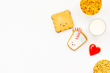 Kids breakfast with milk and funny cookies with cornflakes