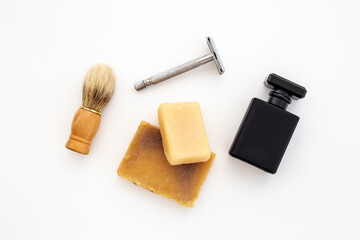 Black perfume bottle for man with shaving accessories