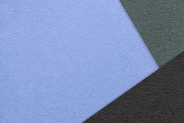 Fototapeta premium Texture of craft blue color paper background with green and black border. Vintage abstract very peri cardboard.