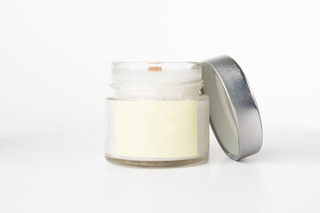 candle with blank label mock up with lid on a white background, aromatherapy, craft home decoration