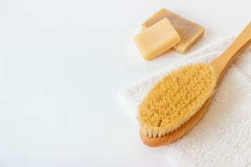 Massage and bath brush with towel. Spa set concept