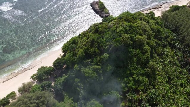 Aerial View of The small island is the main icon of Watu Leter Beach