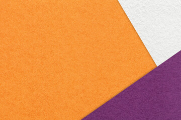 Texture of craft orange color paper background with white and purple border. Vintage abstract ginger cardboard.
