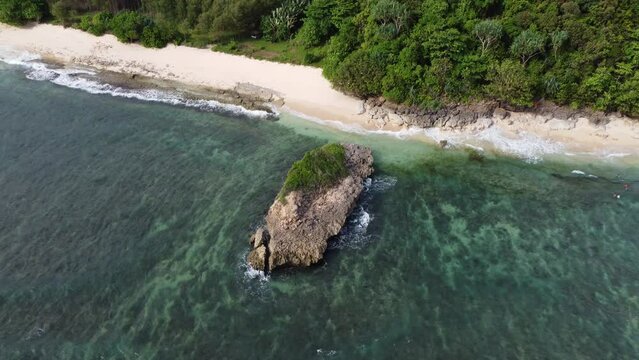 The small island is the main icon of Watu Leter Beach in Indonesia