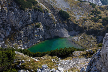 Obraz premium Lower Alpine Lake of Kriški Podi, the highest situated lakes in Slovenia. It is a glacial lake in Julian Alps.