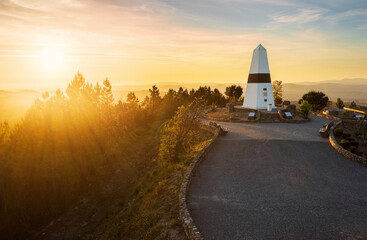 Geodesic center of Portugal in Vila de Rei, with a beautiful sunset in the background.