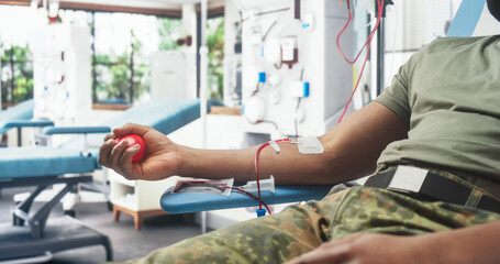Close Up Of Hand Of Black Army Soldier With Attached Catheter In Military Hospital. Brave African...