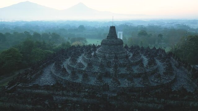 Borobudur temple on the background of sunrise and fog. Aerial view. Java, Indonesia