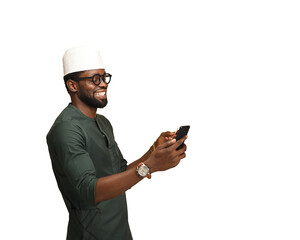 png of Young African American man using smartphones to communicate. The happy young man in glasses takes a selfie with a phone concept. Using a portable device or gadget.