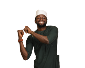 png of a Smiling businessman with a smartphone and white chef hat. Handsome executive dresses in attire and looks away while standing. He is wearing green African northern attire