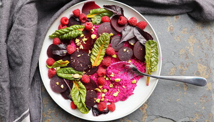 Healthy Beet Salad with raspberry, red pray, nuts