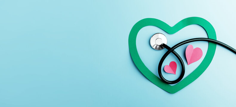 Health Care Awareness Concept. International World Heart Day. Paper Cut as Heart Shape with Stethoscope in Top View. Life, Love and Care for Heart and Cardiovascular