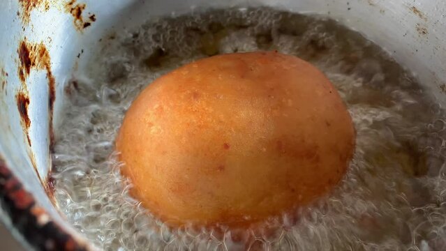 Video of the preparation of "Papa Rellena". traditional Peruvian food made with potatoes. Concept of food.