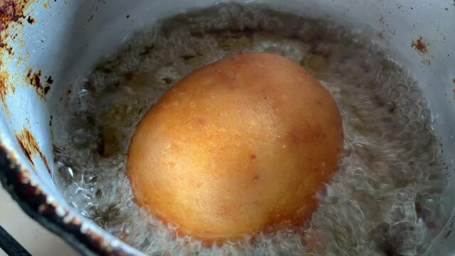 Video of the preparation of "Papa Rellena". traditional Peruvian food made with potatoes. Concept of food.