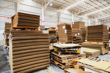 Stacks of cardboard, ready-made box products, packages on pallets inside warehouses, production and export facilities, modern logistics with secure systems. - obrazy, fototapety, plakaty