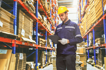 Caucasian man, professional service attendant in cardboard box warehouse, export logistics factory...