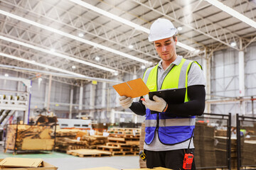 Inspector professional worker cardboard box warehouse export logistics standing checking authenticity sheet paper stamping according mold clipboard during inspection package storage in warehouse.