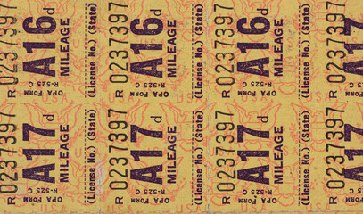 Close up of world war II fuel oil and gas rationing stamps background