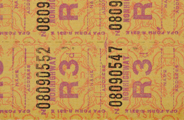 Close up of world war II fuel oil and gas rationing stamps background