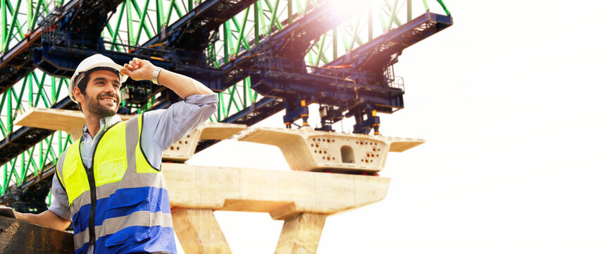 Civil engineer male construction worker project controls planning industry heavy machinery construction size techniques building advanced bridges steel beams road structures interlevel expressways.