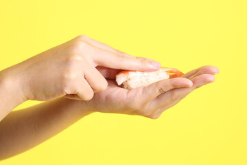 Hand with Sushi