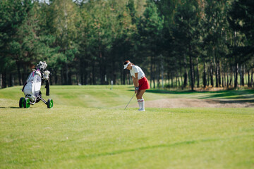 Golfer sports golf course and fairway
