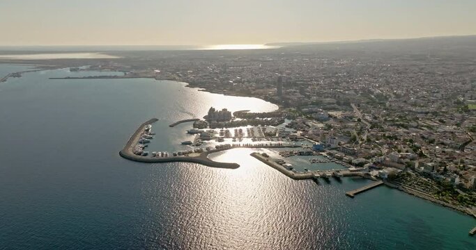 Aerial view of the cityscape of Limassol, Cyprus. Panorama of the city from a bird's eye view of the city's waterfront marina on the sea coast. High quality 4k footage