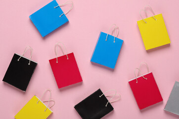 Many Miniature shopping bags on a pink background. Black Friday, world shopping day, sale