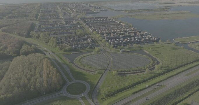 Modern sustainable neighborhood in Almere, Netherlands, with a focus on district heating and a solar panel island. Dlog color profile.