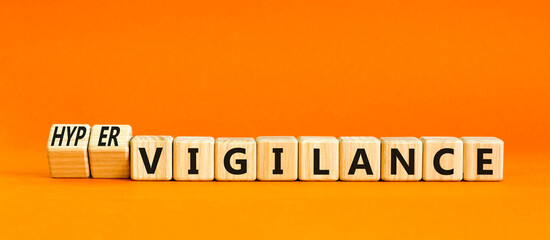 Vigilance or hypervigilance symbol. Concept words Vigilance Hypervigilance on wooden blocks....