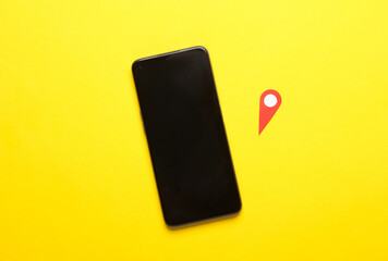 Smartphone and Geolocation Maps Marker point icon on yellow background.