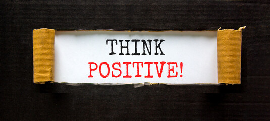 Think positive symbol. Concept words Think positive on beautiful white paper. Beautiful black table black background. Business, motivational think positive thinking concept. Copy space.