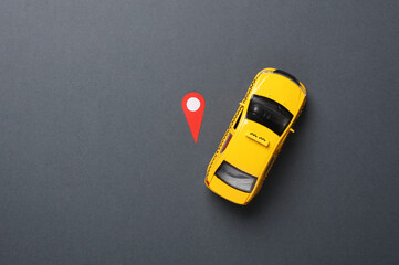 Geolocation Maps Marker point icon with toy taxi car on dark gray background