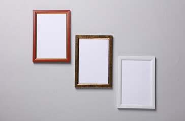 Blank wall frames on a gray background