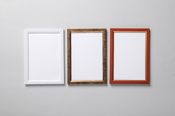 Blank wall frames on a gray background