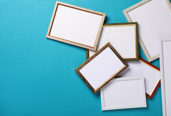 Blank wall frames on blue background