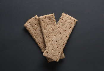 Dietary cereal loaves on a dark gray background. Healthy food concept