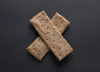 Dietary cereal loaves on a dark gray background. Healthy food concept
