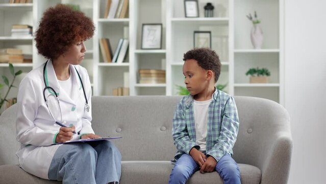 Female speech language therapist teaching preschool kid sound pronunciation, stuttering cute child having stutter; voice ability problem speaking lesson concept