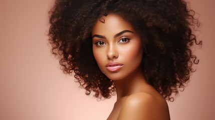 Studio portrait of a young African American woman with curly hair